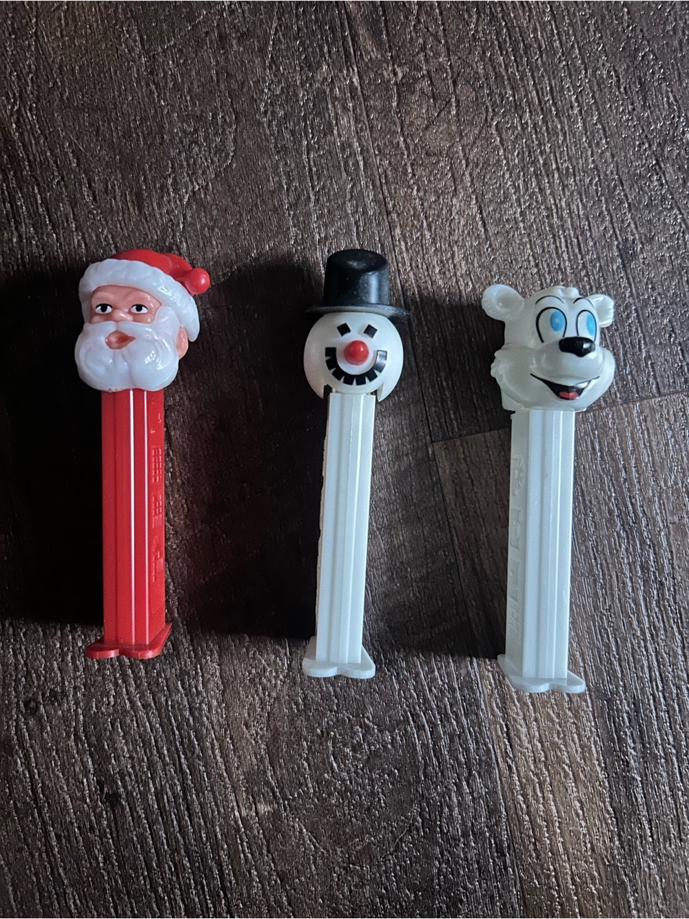 Set of three winter holiday Christmas themed vintage PEZ dispensers